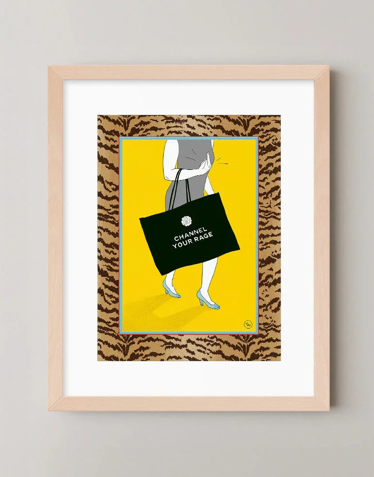 Channel Your Rage risograph style art print featuring tiger print border and Chanel pun shopping bag in a warm maple frame.