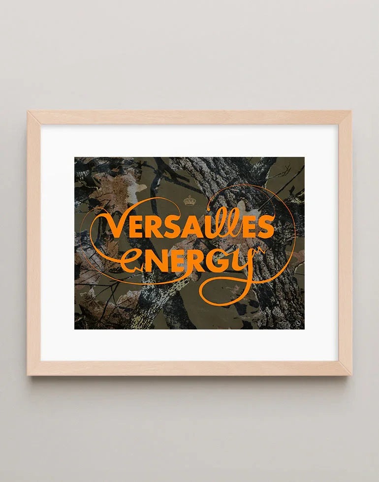 Versailles Energy camouflage orange lettering art print with a maximalist, high-energy vibe in a warm maple frame.
