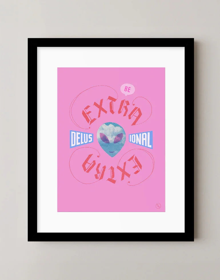 Extra Delusional pink and blue blackletter calligraphy art print featuring an alien face with clouds in a sleek black frame.